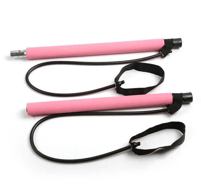 Pink yoga resistance band exerciser handles with straps for strength and flexibility training.